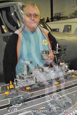 HMS Hermes at Fleet Air Arm Museum - Feb 9, 2013: Model maker Rex Hunt with his model of HMS Hermes. Photo 2