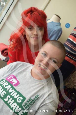 YEOVIL NEWS: Antonia sits in shop window to Brave the Shave Photo 1