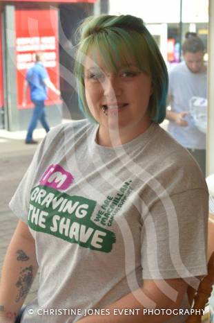 YEOVIL NEWS: Antonia sits in shop window to Brave the Shave Photo 2
