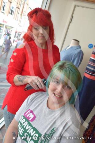 YEOVIL NEWS: Antonia sits in shop window to Brave the Shave Photo 3