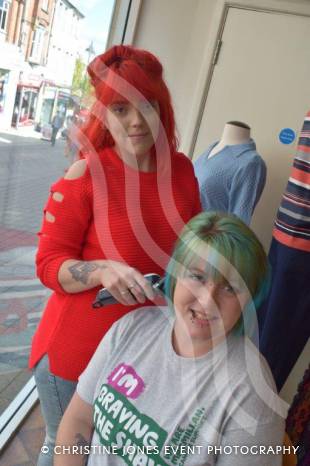 YEOVIL NEWS: Antonia sits in shop window to Brave the Shave Photo 4