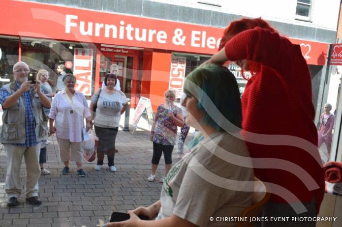 YEOVIL NEWS: Antonia sits in shop window to Brave the Shave Photo 5