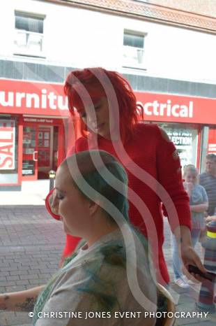 YEOVIL NEWS: Antonia sits in shop window to Brave the Shave Photo 8