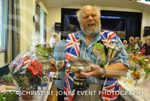 Eric Peadon and his clutch of trophies he won at the Tatworth Flower Show held near Chard, Somerset