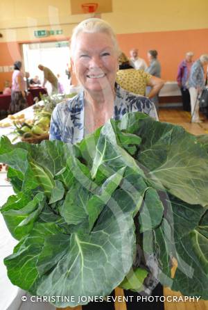 Margaret Excell has her arms full at the Ilminster Flower Show