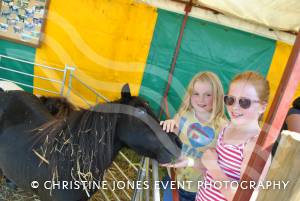 Lauren Smith and Erin Keating find a new friend at Yesterday's Farming