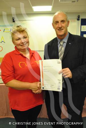 Mariola Kobos receives her City and Guilds certificate from M&O Training managing director Paul Organ