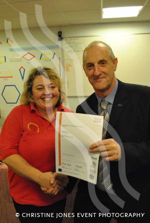 Tracey Card receives her City and Guilds certificate from M&O Training managing director Paul Organ