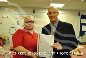 Amanda Austin receives her City and Guilds certificate from M&O Training managing director Paul Organ