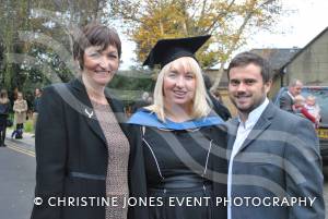 Graduate Michelle Sharpe, centre, with James Collins and mum Louise Salter.