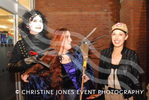 Anita Huish, centre, of Co-op in Chard, looks for help from Hallowe’en party organiser Michelle Young, of Razooks, while Edward Scissorhands, better known as Tony Young, looks to snip away at Anita’s hair.