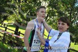 Fourth-placed Alex Rogers receives his medal from Olympic torchbearer Tonia White on November 4, 2012
