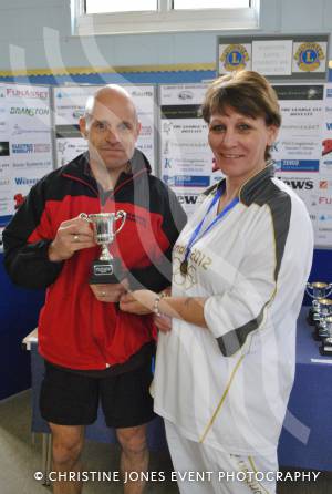 Age category winner Mike Pearce with Olympic torchbearer Tonia White.