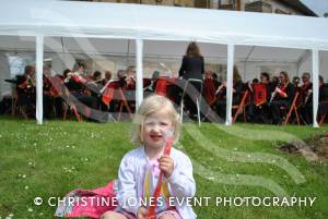 Kingsbury May Festival - May 5, 2014: The annual festival at Kingsbury Episcopi was once again attended by thousands of people. Three-year-old Anna Spencer with Kingsbury Band in the background. Photo 15