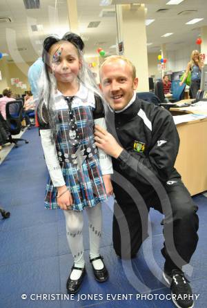 A young Children in Need supporter at Screwfix in Yeovil with Yeovil Town FC coach Darren Way on Friday, November 16, 2012. Photo 9