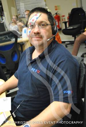 A Screwfix call centre worker in Yeovil on November 16, 2012, gets ready to take calls from people wanting to donate to the Children in Need appeal. Photo 17