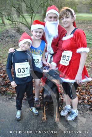 Santa Dash in Yeovil - Dec 16, 2012: Gill and Cris Macpherson with sons Luke and Ryan (no 31), plus Max the Dog. Photo 8