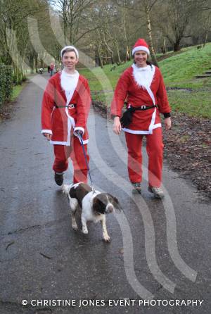 Santa Dash in Yeovil - Dec 16, 2012: Last but not least were Hilary and Greg Morris, while 'tail-ender' was Max the Dog. Photo 77