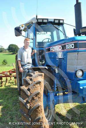 August 2012: Michael Butland, of Hambridge, is seen with his Ford 8210 Series 2 tractor at the Yesterday's Farming event at Haselbury Plucknett.