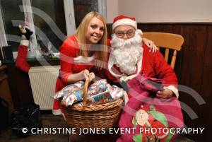 12th Night of Christmas - a festive gallery: Father Christmas and helper at the Brewers Arms in South Petherton. Photo 4
