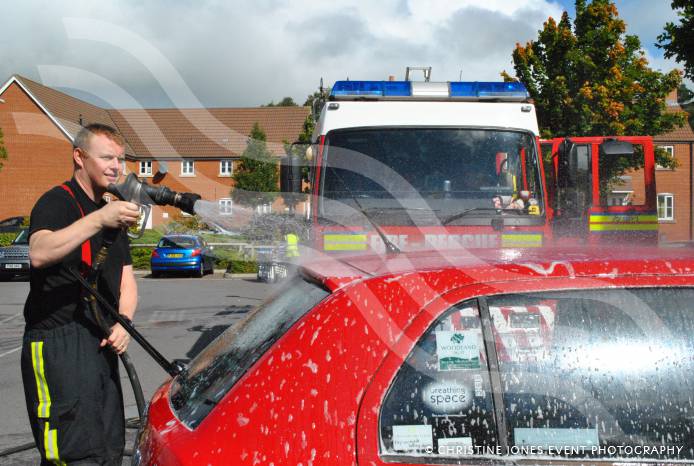 SOUTH SOMERSET NEWS: Firefighters hose down cars for charity funds